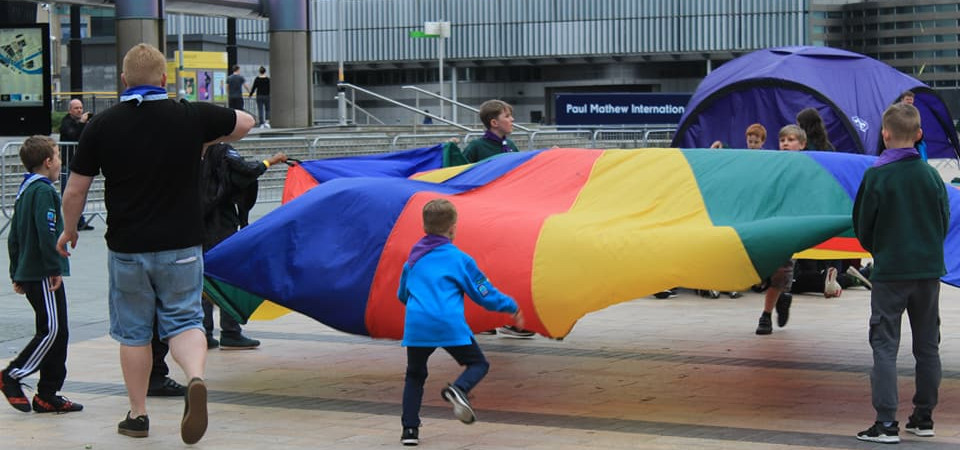 Lowry Scouts play with parachute